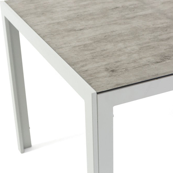 Milo – tavolo in alluminio con piano in vetro decorato, struttura bianco, top tavolo pietra grigio