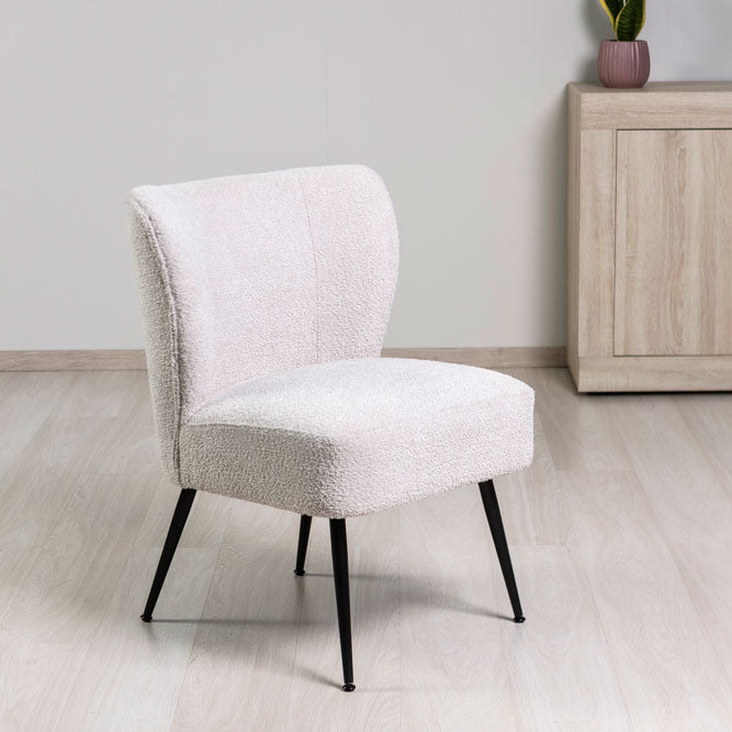 Irene – poltrona in tessuto bouclé con struttura a molle
