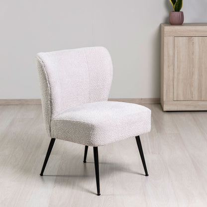 Irene – poltrona in tessuto bouclé con struttura a molle