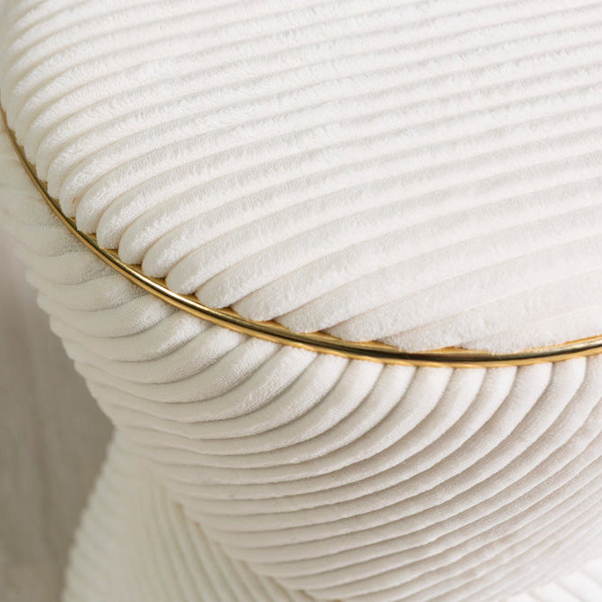 Kora – pouf in velluto a clessidra con profilo dorato